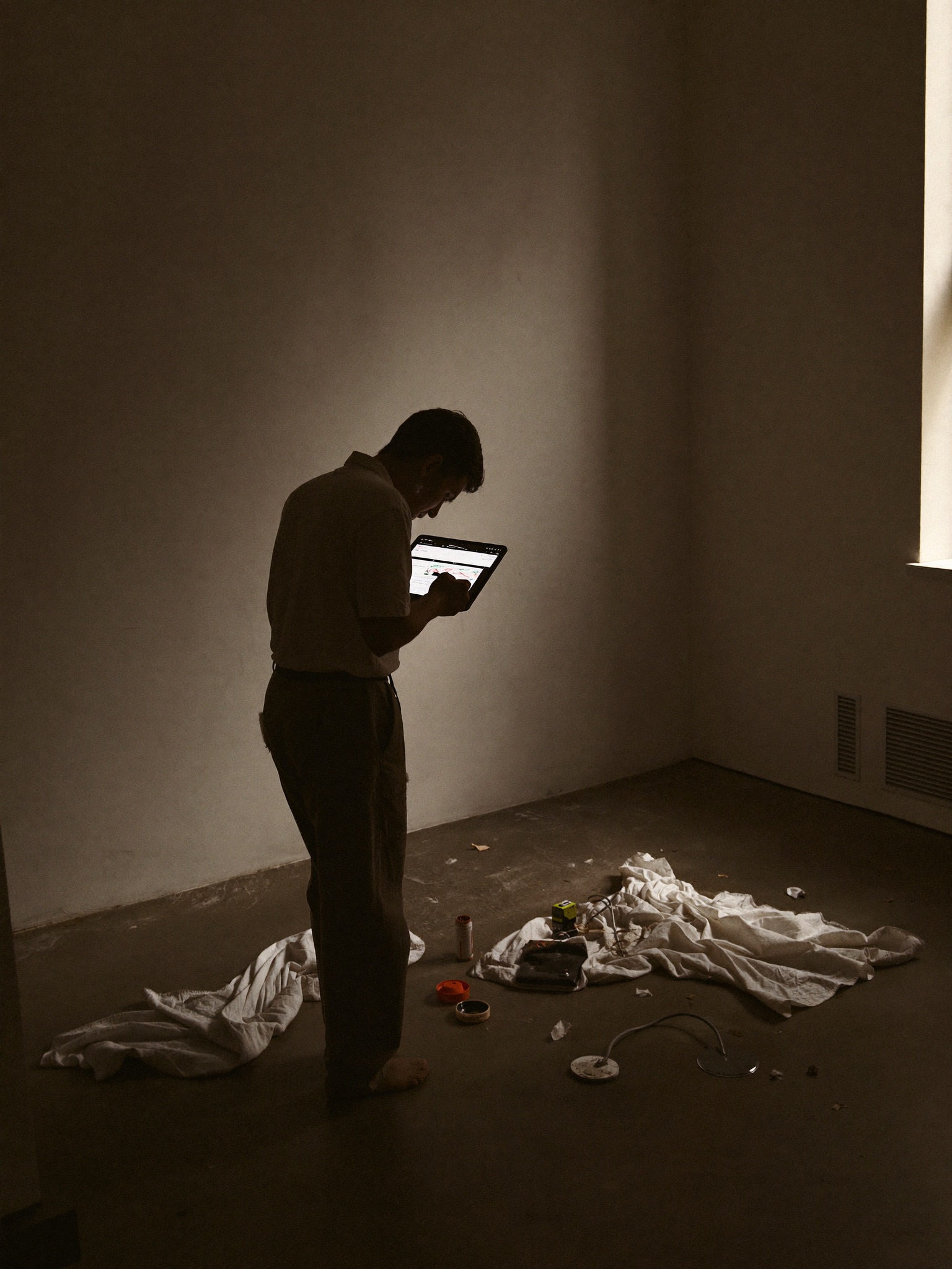 Painter reviewing a project scope at the home